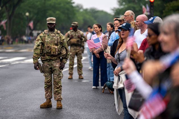 Members of the National Guard patrol the Memorial Day Parade as it passes down Constitution Avenue on Memorial Day in Washington, DC on Monday, May 25, 2026.  WAP20260525316 BONNIExCASH