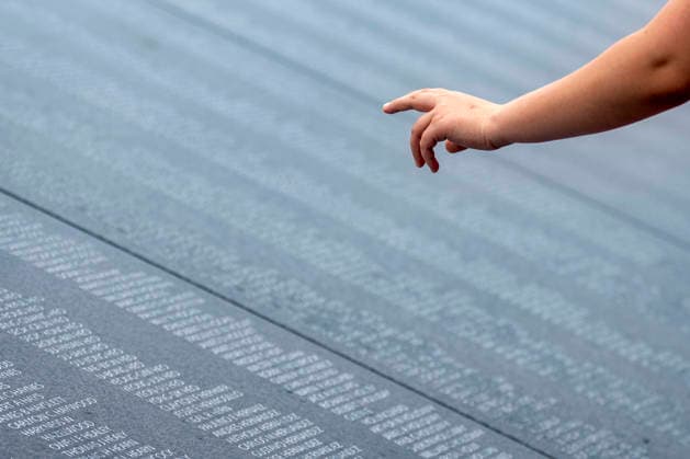 A boy points to names at the Korean War Memorial on Memorial Day in Washington, DC on Monday, May 25, 2026.  WAP20260525332 BONNIExCASH