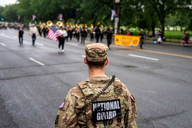 Members of the National Guard patrol the Memorial Day Parade as it passes down Constitution Avenue on Memorial Day in Washington, DC on Monday, May 25, 2026.  WAP20260525335 BONNIExCASH