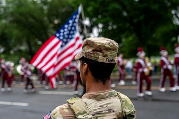 Members of the National Guard patrol the Memorial Day Parade as it passes down Constitution Avenue on Memorial Day in Washington, DC on Monday, May 25, 2026.  WAP20260525337 BONNIExCASH