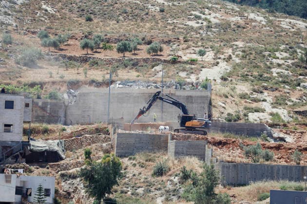 Israeli Demolition West Bank Family Displaced Eid Al-Adha A demolition excavator operates on a concrete structure on a hillside in Nahhalin, occupied West Bank, on May 25, 2026. The demolition, carried out by Israeli forces who stated the structure was built without a permit, displaced an eight-member Palestinian family just two days before the Islamic holiday of Eid al-Adha. Bethlehem West Bank Palestinian Territories Copyright: xMosabxShawerx