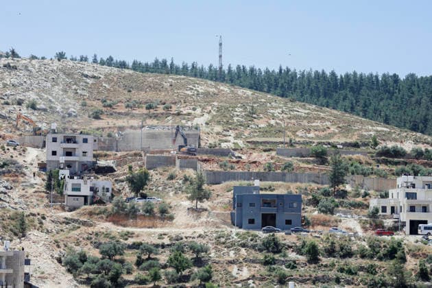 Israeli Demolition West Bank Family Displaced Eid Al-Adha A demolition excavator operates on a concrete structure on a hillside in Nahhalin, occupied West Bank, on May 25, 2026. The demolition, carried out by Israeli forces who stated the structure was built without a permit, displaced an eight-member Palestinian family just two days before the Islamic holiday of Eid al-Adha. Bethlehem West Bank Palestinian Territories Copyright: xMosabxShawerx