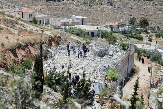 Israeli Demolition West Bank Family Displaced Eid Al-Adha People gather on the rubble of a destroyed building in Nahhalin, occupied West Bank, on May 25, 2026. The demolition, carried out by Israeli forces who stated the structure was built without a permit, displaced an eight-member Palestinian family just two days before the Islamic holiday of Eid al-Adha. Bethlehem West Bank Palestinian Territories Copyright: xMosabxShawerx
