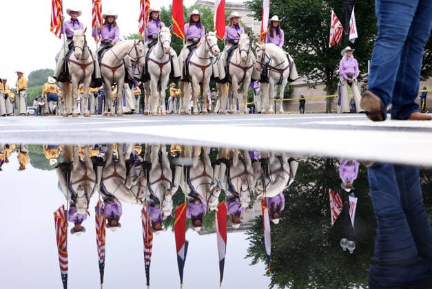 National Memorial Day Parade in Washington DC, USA. Members of the Six White Horses team from Hardin-Simmons University take part in the National Memorial Day Parade on Constitution Avenue in Washington, DC, USA, on May 25, 2026. The parade has been held annually since 2005, marking its 21st anniversary. Washington USA  Copyright: xMatrixxImagesx xGentxShkullakux