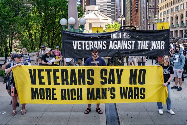 May 25, 2026, Chicago, Illinois, USA: American Veterans and families with About Face carrying banners as they march down Wacker Drive in Downtown Chicago for Memorial Day to protest continued US Wars around the world. The banners read Veterans Say No More Rich Man s Wars and Veterans Against The War Chicago USA - ZUMAr170 20260525_znp_r170_008 Copyright: xChrisxRihax