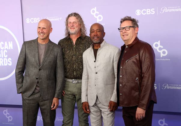 Jim Sonefeld, Mark Bryan, Darius Rucker and Dean Felber of Hootie & the Blowfish attend the 52nd annual American Music Awards at the MGM Grand Garden Arena in Las Vegas on Monday, May 25, 2026.  LAV20260525460 JAMESxATOA