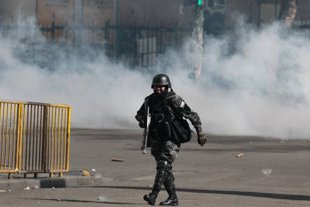 Protest held in La Paz calling for the resignation of Bolivian President Rodrigo Paz LA PAZ, BOLIVIA - MAY 25:A police officer cross through tear gas during clashes between police and protesters demanding the resignation of Bolivian President Rodrigo Paz in La Paz, Bolivia, on May 25, 2026. Jorge Mateo Romay Salinas Anadolu La Paz Bolivia. Editorial use only. Please get in touch for any other usage.  Copyright: x2026xAnadoluxJorgexMateoxRomayxSalinasx