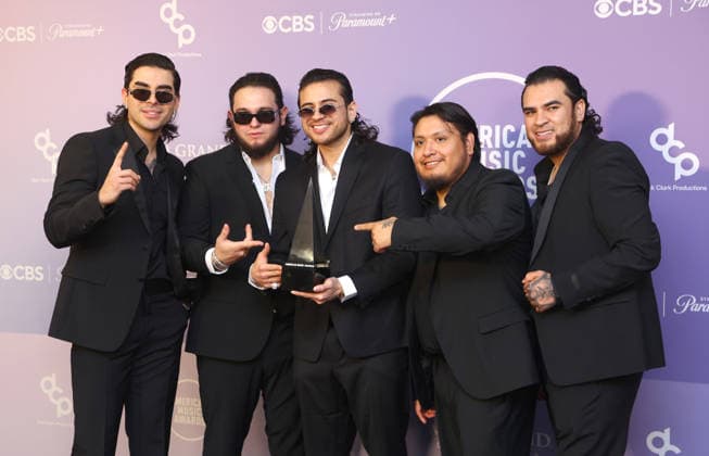 Moisés López, Khrystian Ramos, Jesús Ortíz Paz, Samuel Jáimez and José Garcia of Fuerza Regida, winners of the Best Latin Duo or Group award appear backstage on the winners walk during the 52nd annual American Music Awards at the MGM Grand Garden Arena in Las Vegas on Monday, May 25, 2026.  LAV20260525563 JAMESxATOA