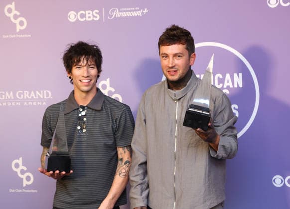 Josh Dun and Tyler Joseph of Twenty One Pilots, winners of the Best Rock Alternative Artist award, appear backstage on the winners walk during the 52nd annual American Music Awards at the MGM Grand Garden Arena in Las Vegas on Monday, May 25, 2026.  LAV20260525566 JAMESxATOA