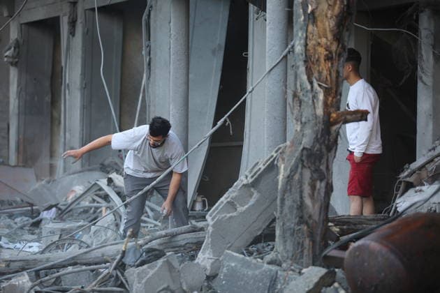 Palestinians inspect damage after Israeli strike in Nuseirat camp Palestinians inspect damage to their homes following an Israeli strike that targeted a house belonging to the al-Tawil family in the Nuseirat refugee camp in the central Gaza Strip on May 25, 2026. The strike destroyed the house completely and caused severe damage to neighboring homes. According to Palestinian medical sources, four Palestinians were wounded in the attack, which came after residents were warned to evacuate the area the previous night. Photo by Hassan al-Jedi apaimages Nusairat Gaza Strip Palestinian Territory 260526_Nuseirat_HJ_00(41).jpeg Copyright: xapaimagesxHassanxal-Jedixx xapaimagesx
