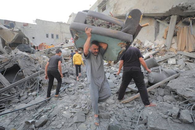 Palestinians inspect damage after Israeli strike in Nuseirat camp Palestinians inspect damage to their homes following an Israeli strike that targeted a house belonging to the al-Tawil family in the Nuseirat refugee camp in the central Gaza Strip on May 25, 2026. The strike destroyed the house completely and caused severe damage to neighboring homes. According to Palestinian medical sources, four Palestinians were wounded in the attack, which came after residents were warned to evacuate the area the previous night. Photo by Hassan al-Jedi apaimages Nusairat Gaza Strip Palestinian Territory 260526_Nuseirat_HJ_00(24).jpeg Copyright: xapaimagesxHassanxal-Jedixx xapaimagesx