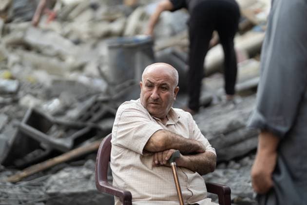 Israeli army bombed a building in Nuseirat NUSEIRAT, GAZA, PALESTINE - MAY 26: Local residents inspect the destroyed building and the damaged houses following the Israeli strike on a building belonging to the Tawil family in the Nuseirat Refugee Camp in Gaza, Palestine on May 26, 2026. The building was completely destroyed in the attack, while nearby homes were also damaged. Residents went through the rubble to find their belongings. Mahmoud Abu Hamda Anadolu Nuseirat Gaza. Editorial use only. Please get in touch for any other usage.  Copyright: x2026xAnadoluxMahmoudxAbuxHamdax