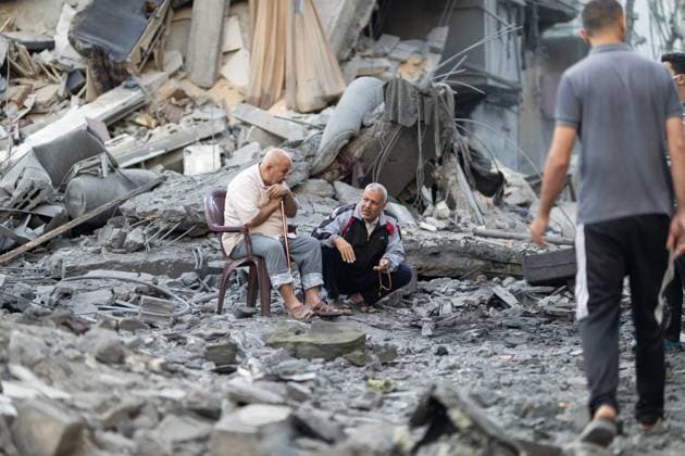 Israeli army bombed a building in Nuseirat NUSEIRAT, GAZA, PALESTINE - MAY 26: Local residents inspect the destroyed building and the damaged houses following the Israeli strike on a building belonging to the Tawil family in the Nuseirat Refugee Camp in Gaza, Palestine on May 26, 2026. The building was completely destroyed in the attack, while nearby homes were also damaged. Residents went through the rubble to find their belongings. Mahmoud Abu Hamda Anadolu Nuseirat Gaza. Editorial use only. Please get in touch for any other usage.  Copyright: x2026xAnadoluxMahmoudxAbuxHamdax