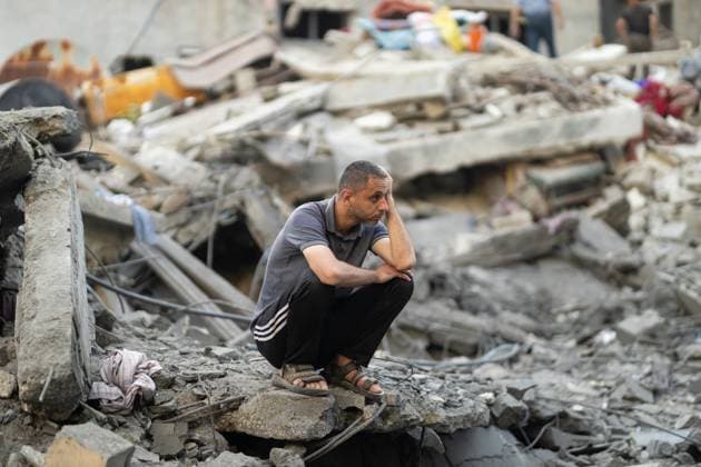 Israeli army bombed a building in Nuseirat NUSEIRAT, GAZA, PALESTINE - MAY 26: Local residents inspect the destroyed building and the damaged houses following the Israeli strike on a building belonging to the Tawil family in the Nuseirat Refugee Camp in Gaza, Palestine on May 26, 2026. The building was completely destroyed in the attack, while nearby homes were also damaged. Residents went through the rubble to find their belongings. Mahmoud Abu Hamda Anadolu Nuseirat Gaza. Editorial use only. Please get in touch for any other usage.  Copyright: x2026xAnadoluxMahmoudxAbuxHamdax