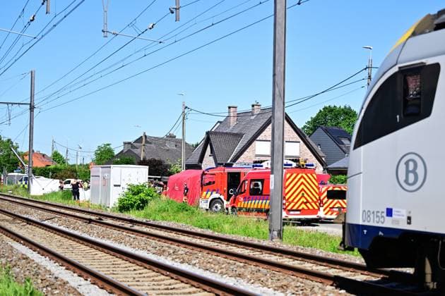 Emergency services pictured at the scene of an accident between a train and a minivan, at the railway crossing Vierhuizen, in Buggenhout, Tuesday 26 May 2026. The accident happened around 8:15 am. Several people have been killed. According to initial reports, the level crossing was closed at the time of the accident.  DIRKxWAEM 175089929