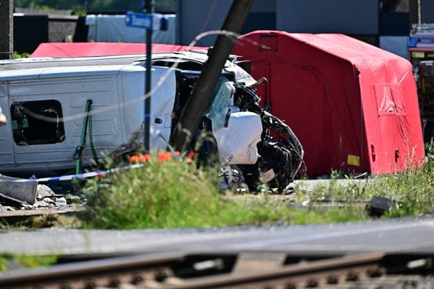 the scene of an accident between a train and a minivan, at the railway crossing Vierhuizen, in Buggenhout, Tuesday 26 May 2026. The accident happened around 8:15 am. Several people have been killed. According to initial reports, the level crossing was closed at the time of the accident.  DIRKxWAEM 175090123