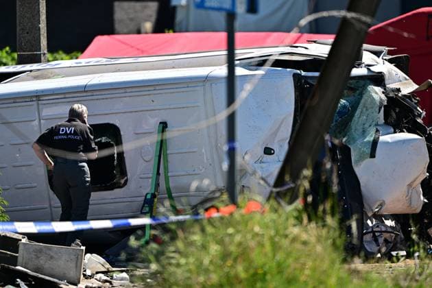 The DVI Disaster Victim Identification team of the federal police pictured at the scene of an accident between a train and a minivan, at the railway crossing Vierhuizen, in Buggenhout, Tuesday 26 May 2026. The accident happened around 8:15 am. Several people have been killed. According to initial reports, the level crossing was closed at the time of the accident.  DIRKxWAEM 175090856