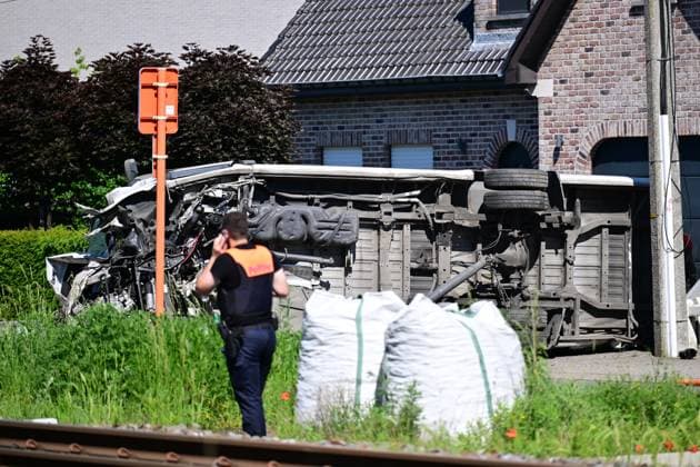 Police pictured at the scene of an accident between a train and a minivan, at the railway crossing Vierhuizen, in Buggenhout, Tuesday 26 May 2026. The accident happened around 8:15 am. Several people have been killed. According to initial reports, the level crossing was closed at the time of the accident.  DIRKxWAEM 175092795