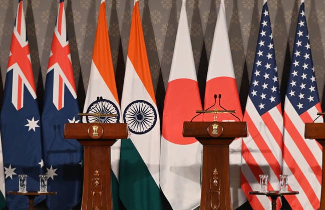 NEW DELHI, INDIA - MAY 26: National flags of Australia, India, Japan, and the United States stood side-by-side during joint press conference following the conclusion of the 11th Quad Foreign Ministers Meeting at Hyderabad House on May 26, 2026 in New Delhi, India. The ministerial summit hosted by Indian External Affairs Minister S Jaishankar brought together US Secretary of State Marco Rubio, Australian Foreign Minister Penny Wong, and Japanese Foreign Minister Toshimitsu Motegi at a time of severe global supply chain friction and ongoing maritime posturing.(Photo by Arvind Yadav Hindustan Times) 11th Quad Foreign Ministers Meeting In Delhi