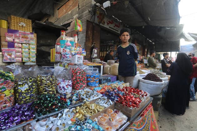 Palestinians walk through Gaza City market ahead of Eid al-Adha Palestinians walk through Al-Zawiya market in Gaza City on May 26, 2026, ahead of Eid al-Adha, as vendors display goods on temporary stalls. The market witnessed weak consumer demand and declining purchasing power amid worsening economic conditions caused by the ongoing war. Photo by Bilal Osama apaimages Gaza city Gaza Strip Palestinian Territory 260526_Gaza_BO_01(9) Copyright: xapaimagesxBilalxOsamax xapaimagesx