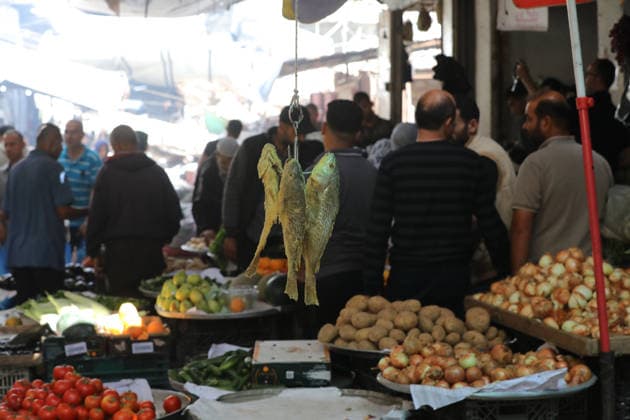 Palestinians walk through Gaza City market ahead of Eid al-Adha Palestinians walk through Al-Zawiya market in Gaza City on May 26, 2026, ahead of Eid al-Adha, as vendors display goods on temporary stalls. The market witnessed weak consumer demand and declining purchasing power amid worsening economic conditions caused by the ongoing war. Photo by Bilal Osama apaimages Gaza city Gaza Strip Palestinian Territory 260526_Gaza_BO_01(16) Copyright: xapaimagesxBilalxOsamax xapaimagesx