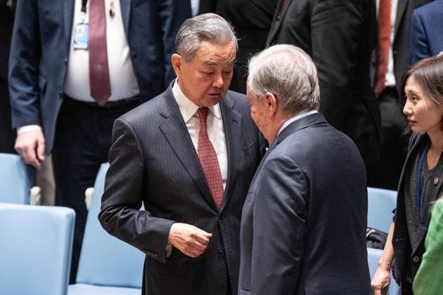 May 26, 2026, New York, New York, USA: Wang Yi, Member of the Political Bureau of the CPC Central Committee and Minister for Foreign Affairs of China speaks with Secretary-General Antonio Guterres before the Security Council meeting on Upholding the purposes and principles of the UN Charter and strengthening the UN-centered international system at UN Headquarters in New York, NY on May 26, 2026. China organized this meeting as it is a President of Security Council for the month of May. New York USA - ZUMAr339 20260526_znp_r339_015 Copyright: xLevxRadinx