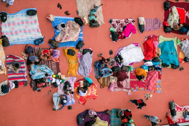 May 26, 2026, Dhaka, Munshiganj, Bangladesh: MUNSHIGANJ, BANGLADESH Ã¢â‚¬ MAY 2026: An aerial top-down view captured from the Mukterpur Bridge in Munshiganj shows overcrowded passenger ferries (locally known as launches) traveling along the river, packed with thousands of home-bound people leaving Dhaka s Sadarghat terminal. Every year, ahead of the Muslim festival of Eid-ul-Adha, millions of people working in the capital city Dhaka endure hectic journeys and brave overcrowded public transport to return to their ancestral villages and celebrate the festival with their families. Many passengers who fail to secure indoor cabins opt to spend the hours-long journey on the open top decks, layout out colorful blankets, mats, and sheets to rest - ZUMAa259 20260526_zip_a259_003 Copyright: xRayhanxAhmedx