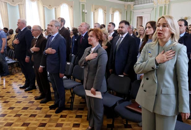 RECORD DATE NOT STATED Participants place their hands over their hearts during the national anthem of Ukraine at the forum Ukraine–Africa: Past, Present and Future of Relations in Kyiv, Ukraine, on May 26, 2026. The event was organized to mark Africa Day 2026 in Ukraine at the Hennadii Udovenko Diplomatic Academy of Ukraine under the Ministry of Foreign Affairs (Photo by Pavlo Bahmut Ukrinform) Forum Ukraine–Africa Past, Present and Future of Relations held in Kyiv  Copyright: xPavloxBahmutx