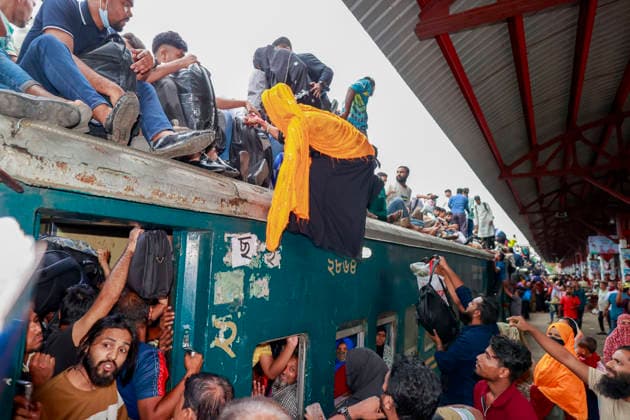 May 26, 2026, Tongi, Bangladesh: Bangladeshi Muslim passengers struggle to board an overcrowded train as they travel home ahead of the upcoming Eid al-Adha festival at a railway station in Tongi, near Dhaka, Bangladesh, Monday, May 26, 2024. Millions of people are expected to leave the capital in one of the countryÃ¢â‚¬â ¢s largest annual holiday exoduses to celebrate Eid with their families in rural areas. Tongi Bangladesh  - ZUMAd117 20260526_fap_d117_047 Copyright: xSuvraxKantixDasx
