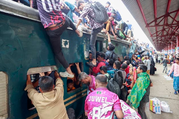 May 26, 2026, Tongi, Bangladesh: Bangladeshi Muslim passengers struggle to board an overcrowded train as they travel home ahead of the upcoming Eid al-Adha festival at a railway station in Tongi, near Dhaka, Bangladesh, Monday, May 26, 2024. Millions of people are expected to leave the capital in one of the countryÃ¢â‚¬â ¢s largest annual holiday exoduses to celebrate Eid with their families in rural areas. Tongi Bangladesh  - ZUMAd117 20260526_fap_d117_050 Copyright: xSuvraxKantixDasx