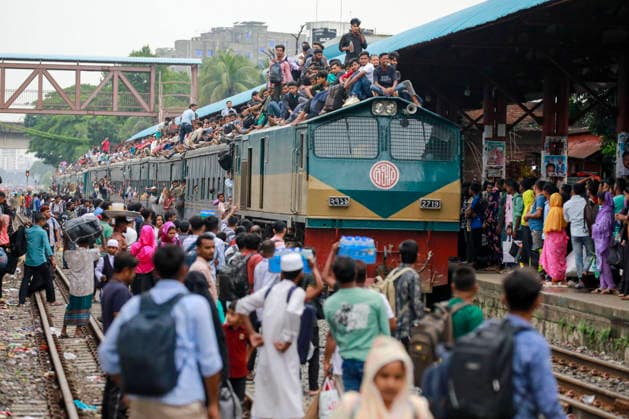 May 26, 2026, Tongi, Bangladesh: Bangladeshi Muslim passengers struggle to board an overcrowded train as they travel home ahead of the upcoming Eid al-Adha festival at a railway station in Tongi, near Dhaka, Bangladesh, Monday, May 26, 2024. Millions of people are expected to leave the capital in one of the countryÃ¢â‚¬â ¢s largest annual holiday exoduses to celebrate Eid with their families in rural areas. Tongi Bangladesh - ZUMAd117 20260526_fap_d117_005 Copyright: xSuvraxKantixDasx