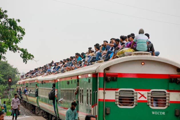 May 26, 2026, Tongi, Bangladesh: Bangladeshi Muslim passengers struggle to board an overcrowded train as they travel home ahead of the upcoming Eid al-Adha festival at a railway station in Tongi, near Dhaka, Bangladesh, Monday, May 26, 2024. Millions of people are expected to leave the capital in one of the countryÃ¢â‚¬â ¢s largest annual holiday exoduses to celebrate Eid with their families in rural areas. Tongi Bangladesh - ZUMAd117 20260526_fap_d117_006 Copyright: xSuvraxKantixDasx