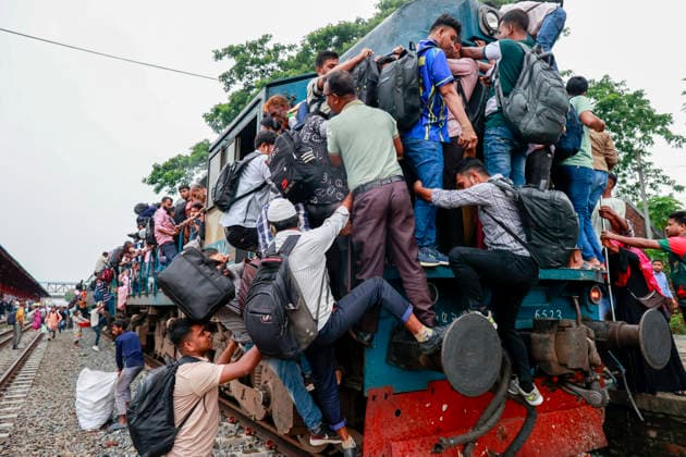 May 26, 2026, Tongi, Bangladesh: Bangladeshi Muslim passengers struggle to board an overcrowded train as they travel home ahead of the upcoming Eid al-Adha festival at a railway station in Tongi, near Dhaka, Bangladesh, Monday, May 26, 2024. Millions of people are expected to leave the capital in one of the countryÃ¢â‚¬â ¢s largest annual holiday exoduses to celebrate Eid with their families in rural areas. Tongi Bangladesh - ZUMAd117 20260526_fap_d117_016 Copyright: xSuvraxKantixDasx