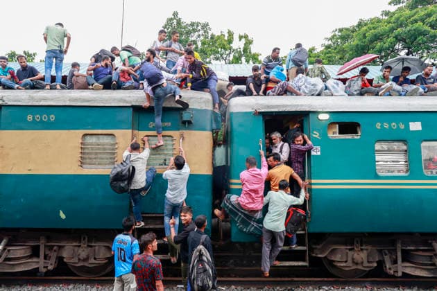 May 26, 2026, Tongi, Bangladesh: Bangladeshi Muslim passengers struggle to board an overcrowded train as they travel home ahead of the upcoming Eid al-Adha festival at a railway station in Tongi, near Dhaka, Bangladesh, Monday, May 26, 2024. Millions of people are expected to leave the capital in one of the countryÃ¢â‚¬â ¢s largest annual holiday exoduses to celebrate Eid with their families in rural areas. Tongi Bangladesh - ZUMAd117 20260526_fap_d117_031 Copyright: xSuvraxKantixDasx