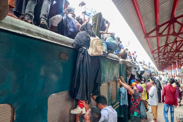 May 26, 2026, Tongi, Bangladesh: Bangladeshi Muslim passengers struggle to board an overcrowded train as they travel home ahead of the upcoming Eid al-Adha festival at a railway station in Tongi, near Dhaka, Bangladesh, Monday, May 26, 2024. Millions of people are expected to leave the capital in one of the countryÃ¢â‚¬â ¢s largest annual holiday exoduses to celebrate Eid with their families in rural areas. Tongi Bangladesh - ZUMAd117 20260526_fap_d117_044 Copyright: xSuvraxKantixDasx
