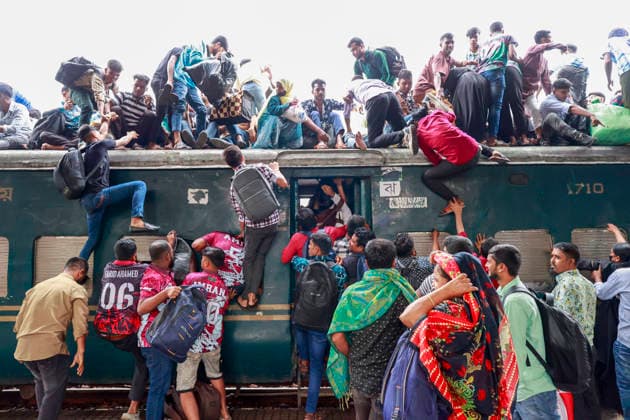 May 26, 2026, Tongi, Bangladesh: Bangladeshi Muslim passengers struggle to board an overcrowded train as they travel home ahead of the upcoming Eid al-Adha festival at a railway station in Tongi, near Dhaka, Bangladesh, Monday, May 26, 2024. Millions of people are expected to leave the capital in one of the countryÃ¢â‚¬â ¢s largest annual holiday exoduses to celebrate Eid with their families in rural areas. Tongi Bangladesh - ZUMAd117 20260526_fap_d117_045 Copyright: xSuvraxKantixDasx