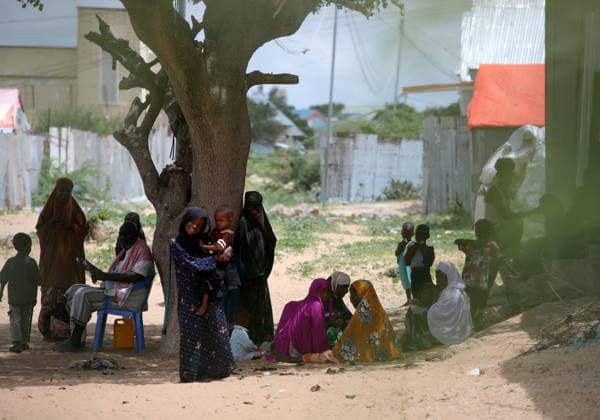Camps turn into permanent settlements amid ongoing crisis in Somalia MOGADISHU, SOMALIA - MAY 26: People spend time in the shadow of a tree as millions of people living in camps that have gradually turned into permanent settlements, where they continue to face difficult living conditions amid insecurity, conflict and drought in the capital Mogadishu, Somalia, on May 26, 2026. Metin Yuksel Kaya Anadolu Mogadishu Somalia. Editorial use only. Please get in touch for any other usage.  Copyright: x2026xAnadoluxMetinxYukselxKayax