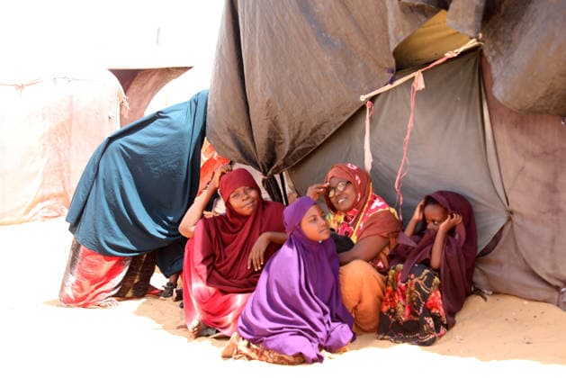 Camps turn into permanent settlements amid ongoing crisis in Somalia MOGADISHU, SOMALIA - MAY 26: Children are seen next to a tens as millions of people living in camps that have gradually turned into permanent settlements, where they continue to face difficult living conditions amid insecurity, conflict and drought in the capital Mogadishu, Somalia, on May 26, 2026. Metin Yuksel Kaya Anadolu Mogadishu Somalia. Editorial use only. Please get in touch for any other usage.  Copyright: x2026xAnadoluxMetinxYukselxKayax