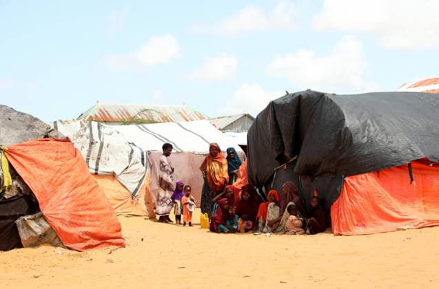 Camps turn into permanent settlements amid ongoing crisis in Somalia MOGADISHU, SOMALIA - MAY 26: Children are seen next to tents as millions of people living in camps that have gradually turned into permanent settlements, where they continue to face difficult living conditions amid insecurity, conflict and drought in the capital Mogadishu, Somalia, on May 26, 2026. Metin Yuksel Kaya Anadolu Mogadishu Somalia. Editorial use only. Please get in touch for any other usage.  Copyright: x2026xAnadoluxMetinxYukselxKayax