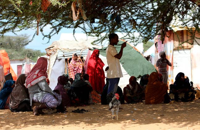 Camps turn into permanent settlements amid ongoing crisis in Somalia MOGADISHU, SOMALIA - MAY 26: People spend time in the shadow of a tree as millions of people living in camps that have gradually turned into permanent settlements, where they continue to face difficult living conditions amid insecurity, conflict and drought in the capital Mogadishu, Somalia, on May 26, 2026. Metin Yuksel Kaya Anadolu Mogadishu Somalia. Editorial use only. Please get in touch for any other usage.  Copyright: x2026xAnadoluxMetinxYukselxKayax