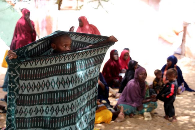 Camps turn into permanent settlements amid ongoing crisis in Somalia MOGADISHU, SOMALIA - MAY 26: People spend time in the shadow of a tree as millions of people living in camps that have gradually turned into permanent settlements, where they continue to face difficult living conditions amid insecurity, conflict and drought in the capital Mogadishu, Somalia, on May 26, 2026. Metin Yuksel Kaya Anadolu Mogadishu Somalia. Editorial use only. Please get in touch for any other usage.  Copyright: x2026xAnadoluxMetinxYukselxKayax