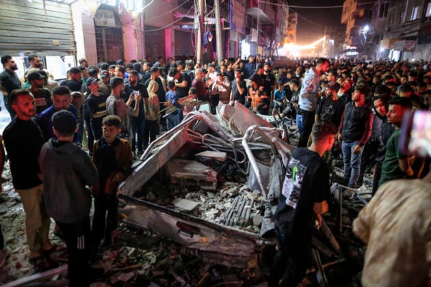 Gaza Rimal District Rocked Strikes Palestinians gather at the site of an airstrike in the Al-Rimal neighborhood of central Gaza City on May 26, 2026, after seven Israeli airstrikes hit a residential building and caused heavy damage to nearby vehicles and commercial shops. Several people were killed and others injured in the strikes, including passersby who had been shopping ahead of Eid. Gaza Gaza Strip Palestinian Territories Copyright: xSaeedxJarasx