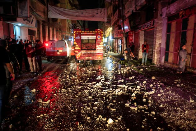 Gaza Rimal District Rocked Strikes Palestinians gather near a fire truck at the site of an airstrike in the Al-Rimal neighborhood of central Gaza City on May 26, 2026, after seven Israeli airstrikes hit a residential building and caused heavy damage to nearby vehicles and commercial shops. Several people were killed and others injured in the strikes, including passersby who had been shopping ahead of Eid. Gaza Gaza Strip Palestinian Territories Copyright: xSaeedxJarasx