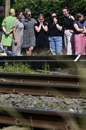 People mourn and lay flowers at the spot of Tuesday s tragic train accident in Buggenhout, on Wednesday 27 May 2026. The accident happened around 8:15 am. Four people have been killed, the driver, two children and their supervisor. According to initial reports, the level crossing was closed at the time of the accident.  DIRKxWAEM 175161881