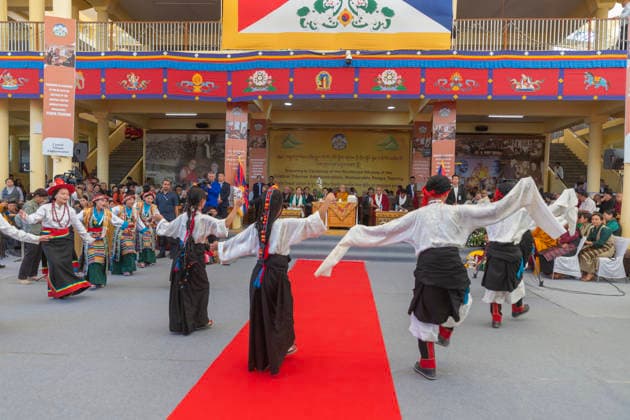 May 27, 2026, Dharamshala, Himachal Pradesh, India: Artist from TIPA perform dance as Tibetan Spiritual Leader the Dalai Lama (c), newly re-elected Sikyong Penpa Tsering (1st R), sitting on the dice with other dignitaries during Swearing-in Ceremony of the re-elected Sikyong of the Central Tibetan Administration (CTA) Penpa Tsering at Tsugla Khang Temple, Mcleodganj, Dharamshala on Wednesday...NOTE; EDITORIAL USE ONLY. Dharamshala India  - ZUMAb235 20260527_zip_b235_009 Copyright: xShaileshxBhatnagarx