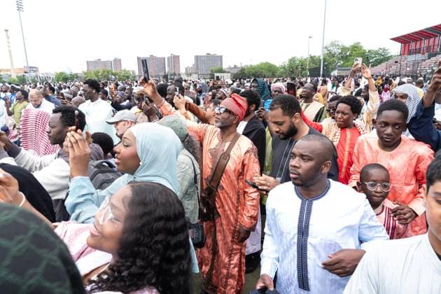 May 27, 2026, New York, New York, USA: People listen to and recording on cell phones as Mayor Zohran Mamdani delivers remarks during Eid Al-Adha holiday prayers at The Yancy Track & Field in New York, NY on May 27, 2026. Hundreds of men, women and children attended wearing clean, colorful and expensive traditional clothes. Eid al-Adha translates from Arabic to Festival of Sacrifice is one of the most important holidays in the Islamic calendar. It honors the Prophet Ibrahim s (Abraham s in Judaism) absolute obedience to God, commemorating his willingness to sacrifice his son as an act of submission before God provided a ram to sacrifice instead. New York USA  - ZUMAr339 20260527_znp_r339_010 Copyright: xLevxRadinx
