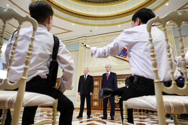 KAZAKHSTAN, ASTANA - MAY 27, 2026: Russia s President Putin and Kazakhstan s President Kassym-Jomart Tokayev (L-R back) are seen during a ceremony marking Putin s arrival at Nursultan Nazarbayev International Airport. The Russian president arrived in Kazakhstan on a state visit. Alexander Kazakov Russian Presidential Press and Information Office TASS  93104202