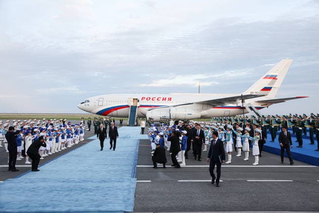 KAZAKHSTAN, ASTANA - MAY 27, 2026: Russia s President Putin and Kazakhstan s President Kassym-Jomart Tokayev (L-R midground) are seen during a ceremony marking Putin s arrival at Nursultan Nazarbayev International Airport. The Russian president arrived in Kazakhstan on a state visit. Alexander Kazakov Russian Presidential Press and Information Office TASS  93104194