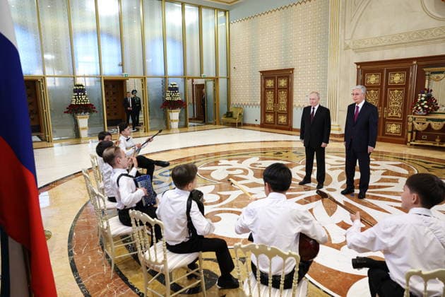 KAZAKHSTAN, ASTANA - MAY 27, 2026: Russia s President Putin and Kazakhstan s President Kassym-Jomart Tokayev (L-R back) are seen during a ceremony marking Putin s arrival at Nursultan Nazarbayev International Airport. The Russian president arrived in Kazakhstan on a state visit. Alexander Kazakov Russian Presidential Press and Information Office TASS  93104208