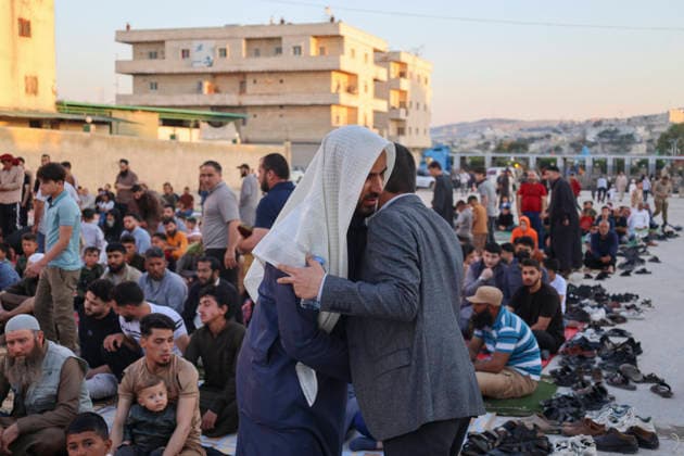 Eid Al-Adha Prayers Idlib Men greet and embrace while gathering for Eid al-Adha prayers in Idlib, Syria, on May 27, 2026. Eid al-Adha, or the Feast of Sacrifice, is one of the most important holidays in the Islamic calendar, commemorating the willingness of Prophet Ibrahim to sacrifice his son. The event is traditionally marked worldwide by communal prayers, family gatherings, acts of charity, and the slaughtering of livestock. Idlib Idlib Syria Copyright: xOmarxAlbawx